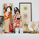 The items for sale at the Japan House Pop-up Holiday Bazaar include dolls, tea sets, dishes, prints and other Asian-themed items.