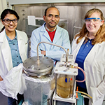 Brajendra Kumar Sharma, center, a senior research scientist at the Illinois Sustainable Technology Center at the U. of I., with research chemist Dheeptha Murali, left, and process chemist Jennifer Deluhery, converted plastic shopping bags into diesel fuel.