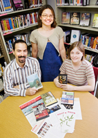 Tanya Lee, standing, program director for Asian Educational Media Service; events coordinator Jason Finkelman; and assistant program coordinator Susan Norris, are responsible for the successful expansion of the service to 118 libraries in East Central Illinois.