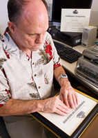 Bryan McMurray is the only staff member in the Disability Resources and Educational Services division who has been trained to use the office's Perkins Braille writer.