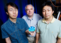 Researchers led by chemistry professor Dana Dlott, center, have improved the sensitivity of a measurement technique that helps in detecting deadly fumes, chemical spills or hidden explosives. Other members of the team are graduate student Ying Fang, left, and postdoctoral research associate Nak-Hyun Seong.