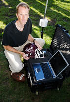 Steven Broglio, professor of kinesiology and community health, is monitoring the blows football players sustain to their heads.Six strategically placed, spring-loaded accelerometers wirelessly beam information to a Web-based system on a laptop computer on the sidelines.