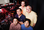 Dana Dlott, professor of chemistry (at right, in yellow shirt) with, (from top, counter clockwise) Jeffrey Carter, Yee Kan Koh, Zhaohui Wang, and Nak-Hyn Seong, and engineering professor David Cahill have now developed an ultrafast thermal measurement technique capable of exploring heat transport in extended molecules fastened at one end to a metal surface.