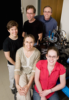 The next generation of self-healing materials, invented by researchers at the University of Illinois, mimics human skin by healing itself time after time. The researchers, clockwise from front, graduate student Katie Toohey; Nancy Sottos and Jennifer Lewis, both professors of materials science and engineering; Scott White, professor of aerospace engineering; and Jeffrey Moore, professor of chemistry, pose in the robocaster lab.
