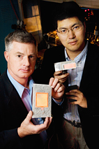Gary Eden, professor and director of the Laboratory for Optical Physics and Engineering, left, with Sung-Jin Park, visiting professor and research scientist in electrical and computer engineering, hold flat-panel lamps made with aluminum foil and tiny plasma arrays their team developed.