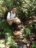 Veterinary pathobiologist Tony Goldberg collects water samples in the Kibale National Park, Uganda.