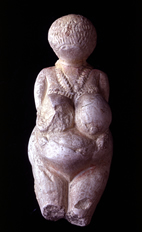 Front and back views of Venus of Kostenki in ivory, dating about 22,000 years ago. The evidence for master weaving comes from fiber artifacts and from 200 