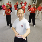 Visiting kinesiology professor Yang Yang leads a group of residents of Clark Lindsey Village in Urbana in Qigong and Taiji. Yang has found that healthy seniors who practiced a combination of Qigong and Tai Chi three times a week for six months experienced significant physical benefits after only two months.