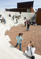 Simon Levin, left in foreground, and U. of I. professor Kevin Hamilton document a student presentation in the amphitheater outside the Krannert Center for the Performing Arts.