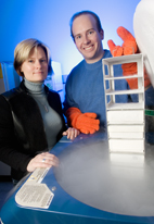 Microbiologist Joanna L. Shisler and Daniel Brian Nichols, a graduate student, retrieve MC160-expressing cell lines from cryostorage.