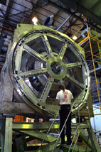 Workers install the 100,000 pound magnet for testing at the University of Illinois prior to the G-Zero experiment at Thomas Jefferson National Accelerator Facility in Newport News, Va.