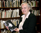Miranda Remnek,  the head of the U. of I. Slavic and East European Library and coordinator of the Andrei Codrescu collection, stands in front of the new acquisition of literary materials that Codrescu recently donated to the library. After the collection is processed, Remnek plans to produce a Web catalog for it.