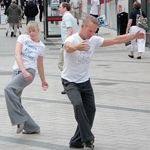 Philip Johnston, right, performs with local professional dancers at the Corn Market in Belfast, Ireland. A focal point in the city where five streets meet, the Corn Market is a major shopping district where musicians, actors and dancers often perform.
