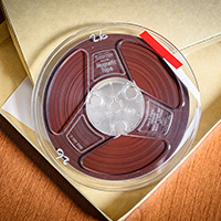 Photo of a reel-to-reel tape in an open box.