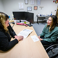 Student Hannah Dederick discusses her career plans with a staff specialist
