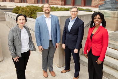 A group photo of Illinois researchers, standing outdoors and socially distanced.