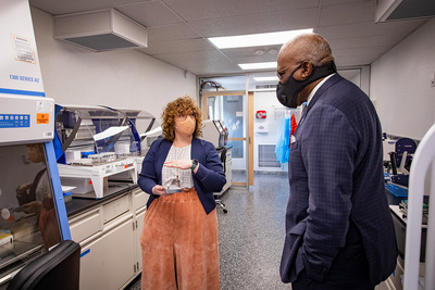 Professor Abigail Wooldridge, left, the project lead for mobileSHIELD, a mobile COVID-19 testing laboratory created by a team from the Grainger College of Engineering, gives Chancellor Robert Jones a tour of the facility. The project will bring COVID-19 testing capability to communities across Illinois and the nation.