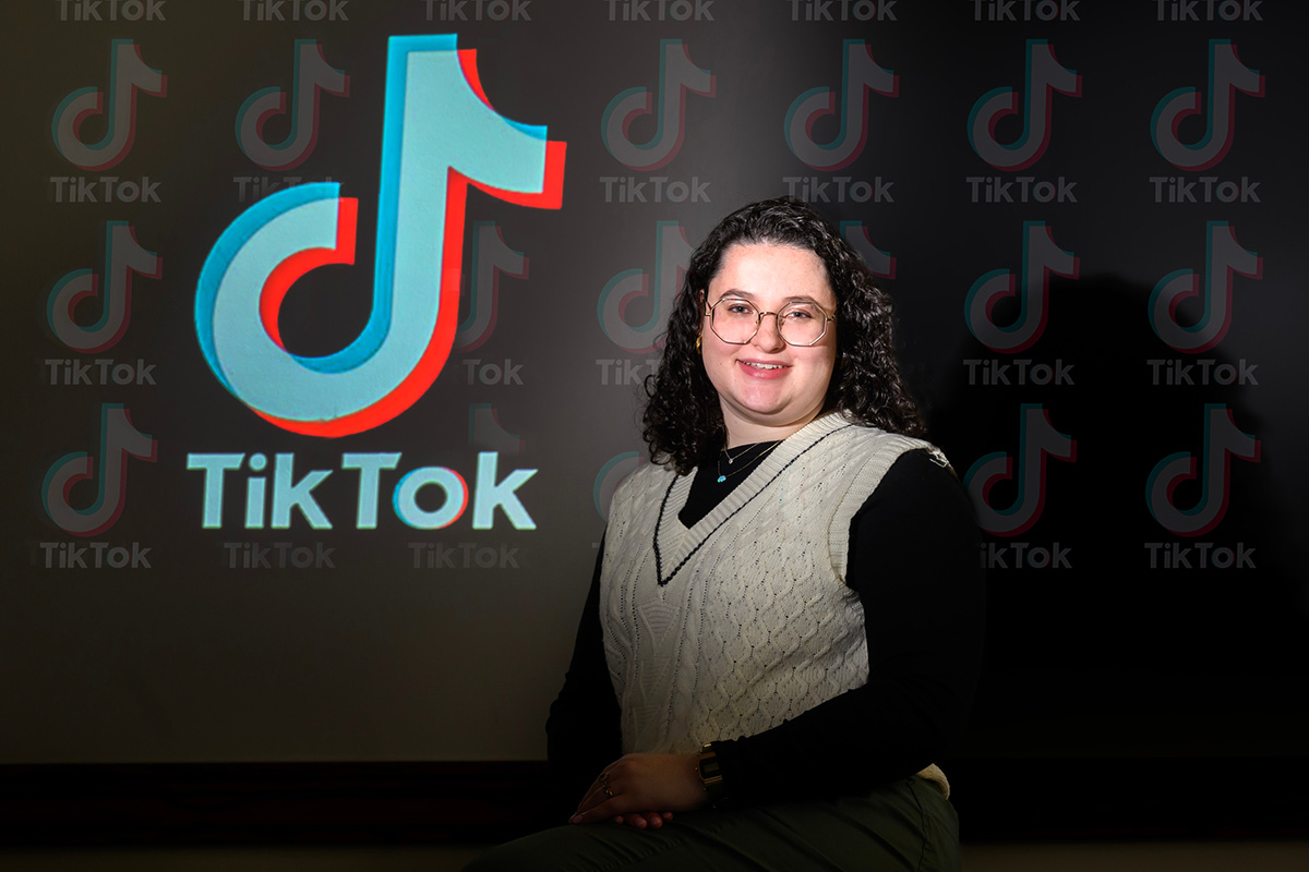 Emily Mendelson with a TikTok logo