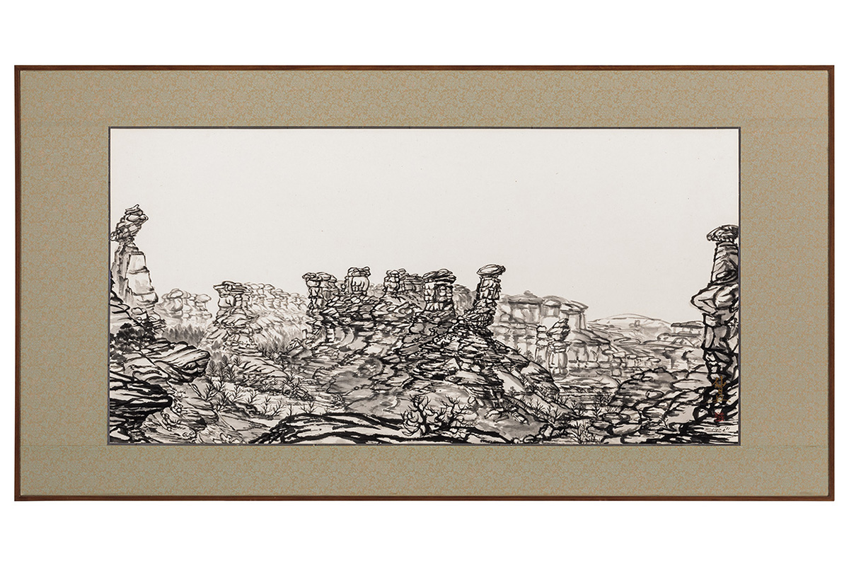 Photo of a Japanese black ink painting of a rocky landscape with rock towers.