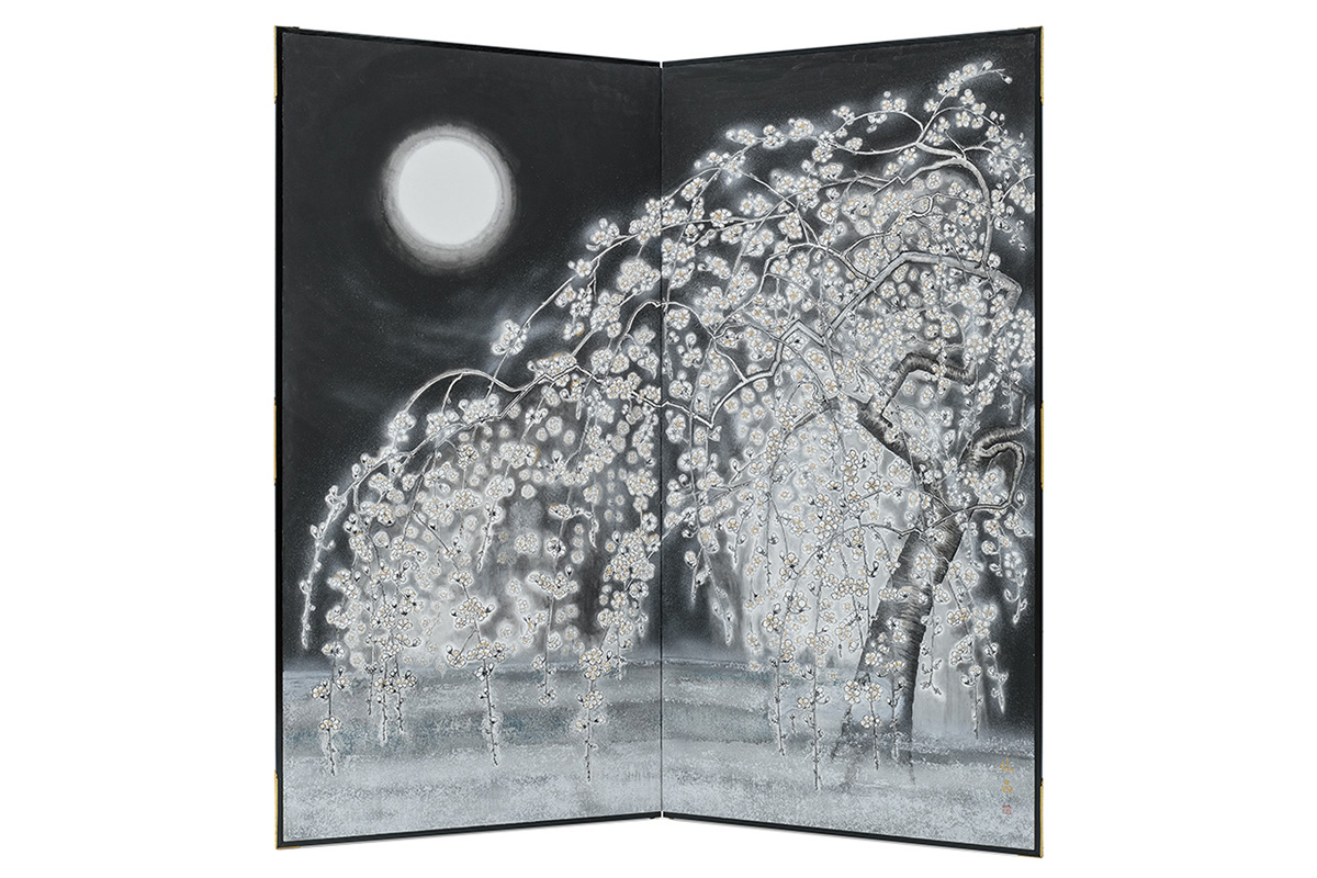 Photo of a Japanese black ink painting of a flowering plum tree in the moonlight, painted on a screen.