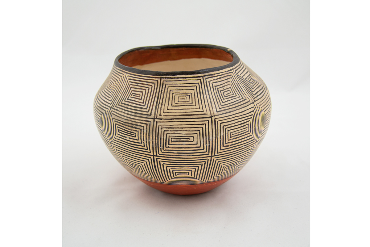 Image of a white Pueblo jar with a design of horizontal and vertical black lines.