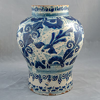 Photo of a vase decorated in a blue and white pattern.