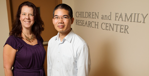 Environmental factors such as crime and poverty rates in the neighborhood where children live influence nonresident fathers' engagement with their children, suggests a new study by Saijun Zhang, right, and Tamara Fuller, both faculty members in the School of Social Work.