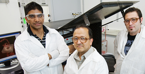 Rashid Bashir, a Bliss Professor of electrical and computer engineering and of bioengineering, center, led the researchers who developed a new solid-state nanopore sensor. He is flanked by graduate students Murali Venkatesan, left, and Sukru Yemenicioglu.