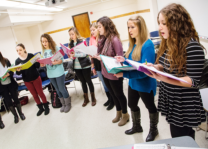 Members of Girls Next Door, the first all-female a cappella group on campus, rehearse the songs in their repertoire.