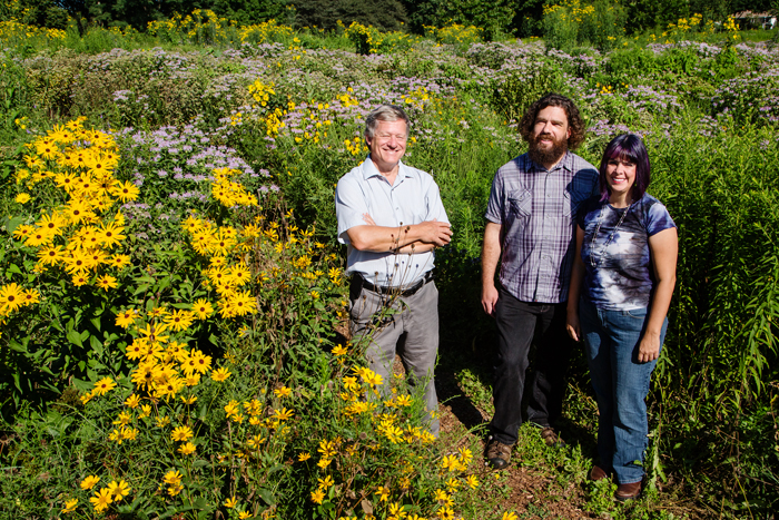 Master Naturalists, from left, John Marlin, Thom Uebele and Jana Uebele stand in the Florida Orchard Prairie, one of the demonstration gardens on campus that Marlin coordinates and maintains. An entomologist, Marlin is a research affiliate with the Illinois Sustainable Technology Center. Thom Uebele is a research programmer with the School of Life Sciences, and his wife, Jana, is an artist.