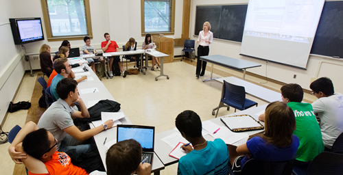 The design of this classroom, being used by rhetoric professor Cheryl Price, gives students plenty of laptop space and brings them closer together duirng more interactive exercises.
