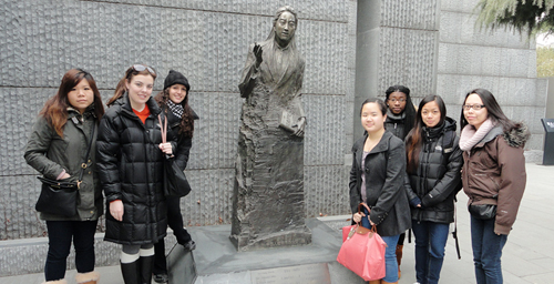 The Illinois group  from the left, Kristin Wang, Riley Wharton, Jenna Kandah, Anny Chang, Kayla Bell, Cheryl de Guzman and Megan Lee  at the statue of the late 1989 U. of I. alumna Iris Chang in the Nanjing Massacre Memorial Hall in Nanjing. Changs best-selling book The Rape of Nanking: The Forgotten Holocaust of World War II was published in 1997 on the 60th anniversary of the Nanking Massacre.