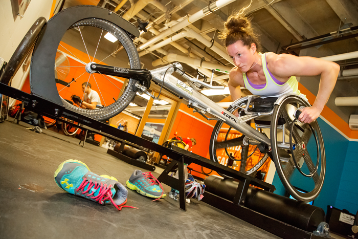 U. of I. graduate Tatyana McFadden pushes herself hard during a workout at the campus Paralympic training facility, one of many campus amenities available for students and athletes with disabilities. McFadden, born with spina bifida and paralyzed from the waist down, in 2013 became the first athlete to win four major marathons in a single year, taking the womens wheelchair division at London, Boston, Chicago and New York City, and repeated the feat in 2014.