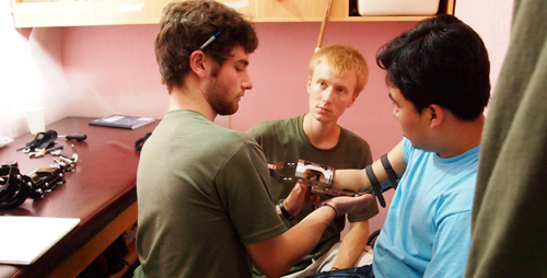 Jonathan Naber, left, and Adam Booher fit the first amputee patient with one of three prototypes Illini Prosthetic Technologies tested on a trip to Guatemala in July 2010.