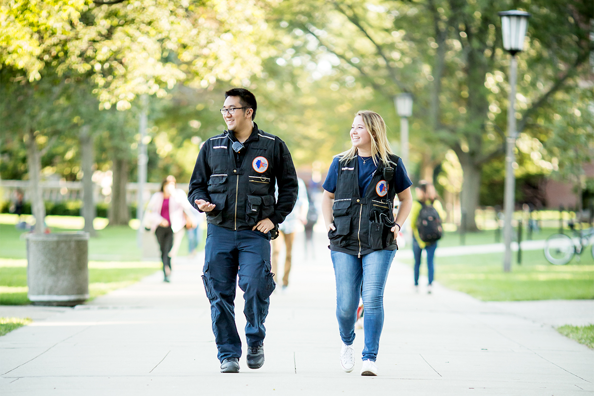 Alex Tran and Angela Annarino are members of the U. of I. Student Patrol, a team of trained students who provide campus safety services.