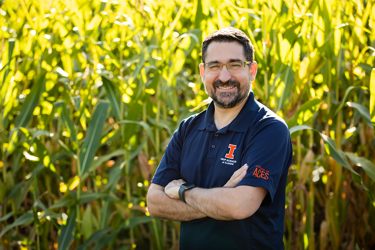 Portrait of Nicolas Martin standing in front of the Morrow Plots cornfield on the U. of I. campus