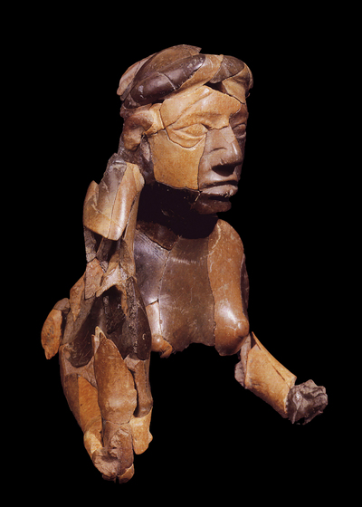 A new exhibit includes the upper torso and head of a red goddess sculpture, carved from stone and found buried at the ancient American Indian city of Cahokia. Note the serpent wrapped around her head. This artifact dates to the 12th century.