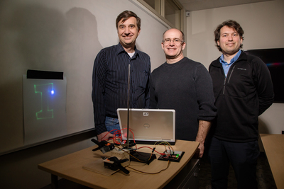 Students in an area middle school learned principles of coordinate math and computer programming by creating a laser light show in a collaborative project started by University of Illinois researchers in education and engineering. The team, from left, Joe Muskin, a visiting education coordinator in mechanical science and engineering; Adam Poetzel, an instructor of mathematics education in curriculum and instruction; and Arend van der Zande, a professor of mechanical science and engineering.