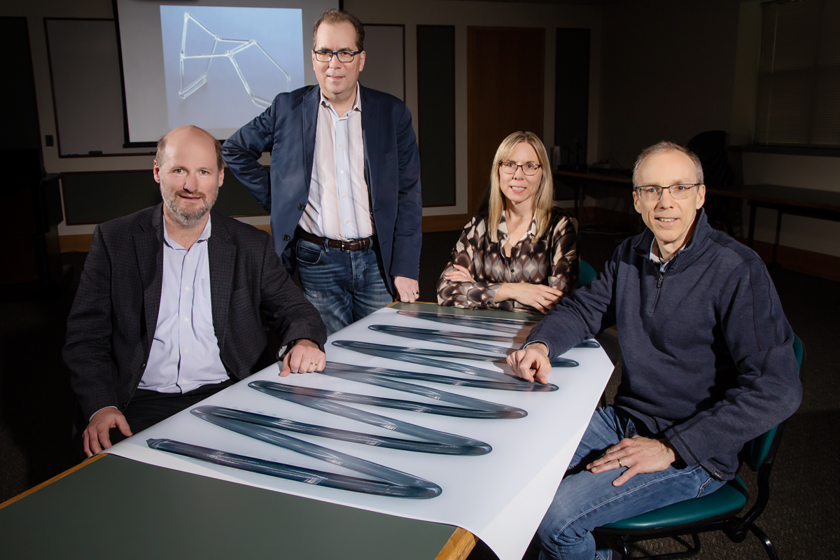 University of Illinois researchers Philippe Geubelle, left, Scott White, Nancy Sottos and Jeffrey Moore have developed a new polymer-curing process that could reduce the amount of time and energy consumed compared with the current manufacturing process.
