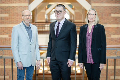Group photo of Beckman Institute director Jeffrey Moore, left, postdoctoral researcher Hai Qian and materials science and engineering head Nancy Sottos