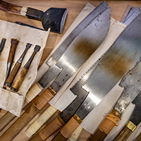 Photo of hand saws and other tools.