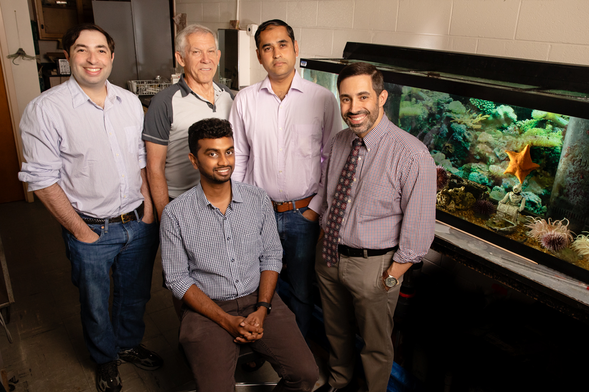 Illinois researchers developed a tiny thermometer to take fast temperatures inside of cells. Pictured, from left: Graduate student Jeffrey W. Brown; Rhanor Gillette, emeritus professor of molecular and integrative physiology; Sanjiv Sinha, professor of mechanical science and engineering; Daniel Llano, professor of molecular and integrative physiology. Front row: graduate student Manju Rajagopal.