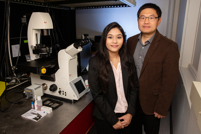 Graduate student Payel Mondal, left, biochemistry professor Kai Zhang and their colleagues developed a new optogenetic technique that will help scientists study protein function.