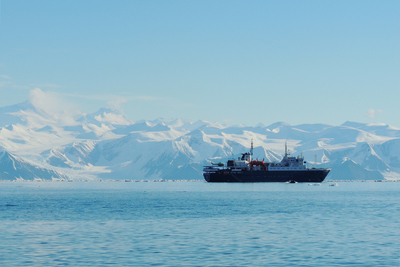 Image of the Admiralty Mountains at Cape Adare, Antarctica, and the ship Ortelius.