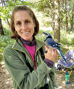 Beveroth holds a blue jay.